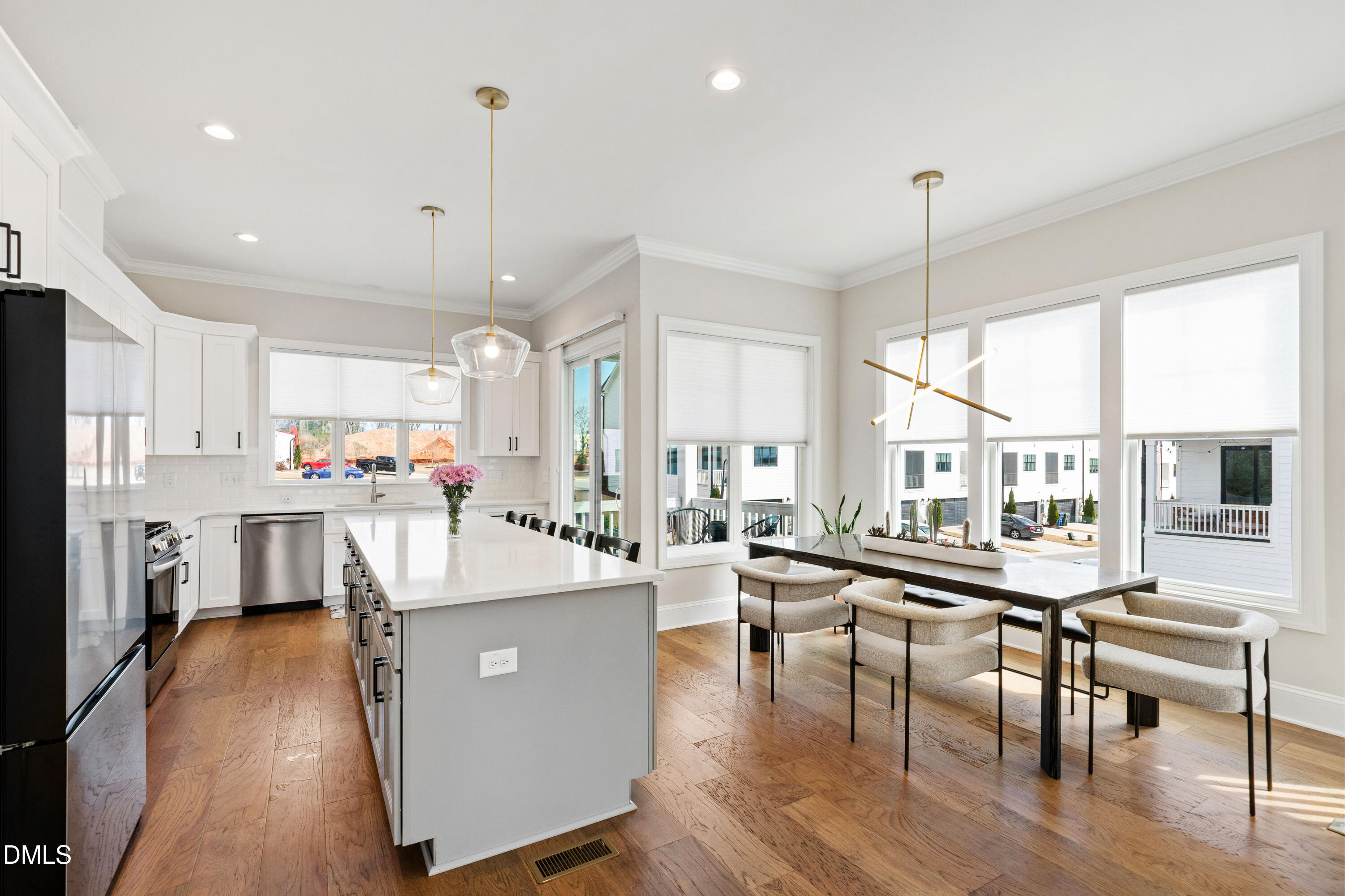4934 Trek Lane Raleigh, NC 27606 - Photo 7 of 35 a large kitchen with a table and chairs
