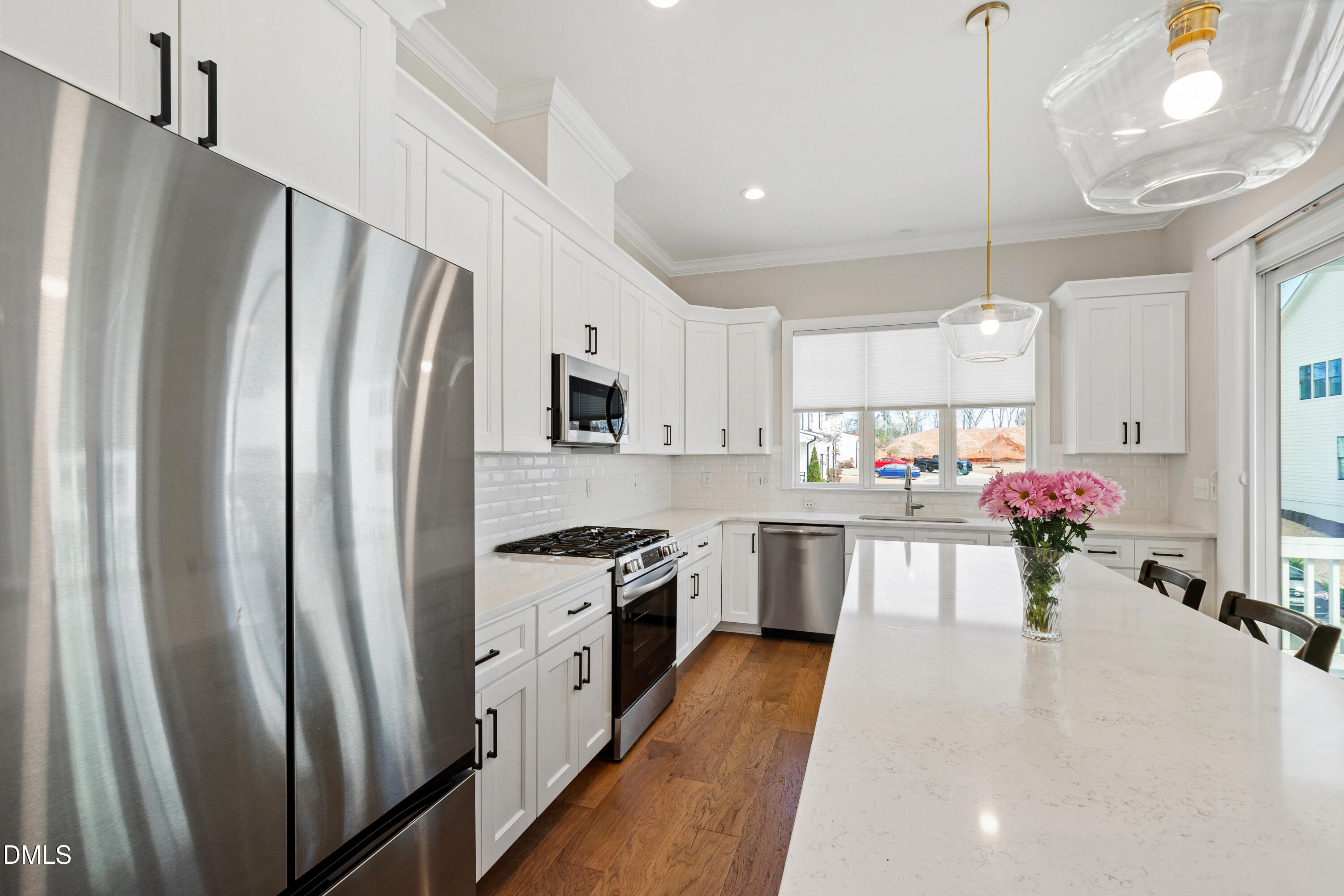 4934 Trek Lane Raleigh, NC 27606 - Photo 8 of 35 a kitchen with sink a refrigerator and a stove
