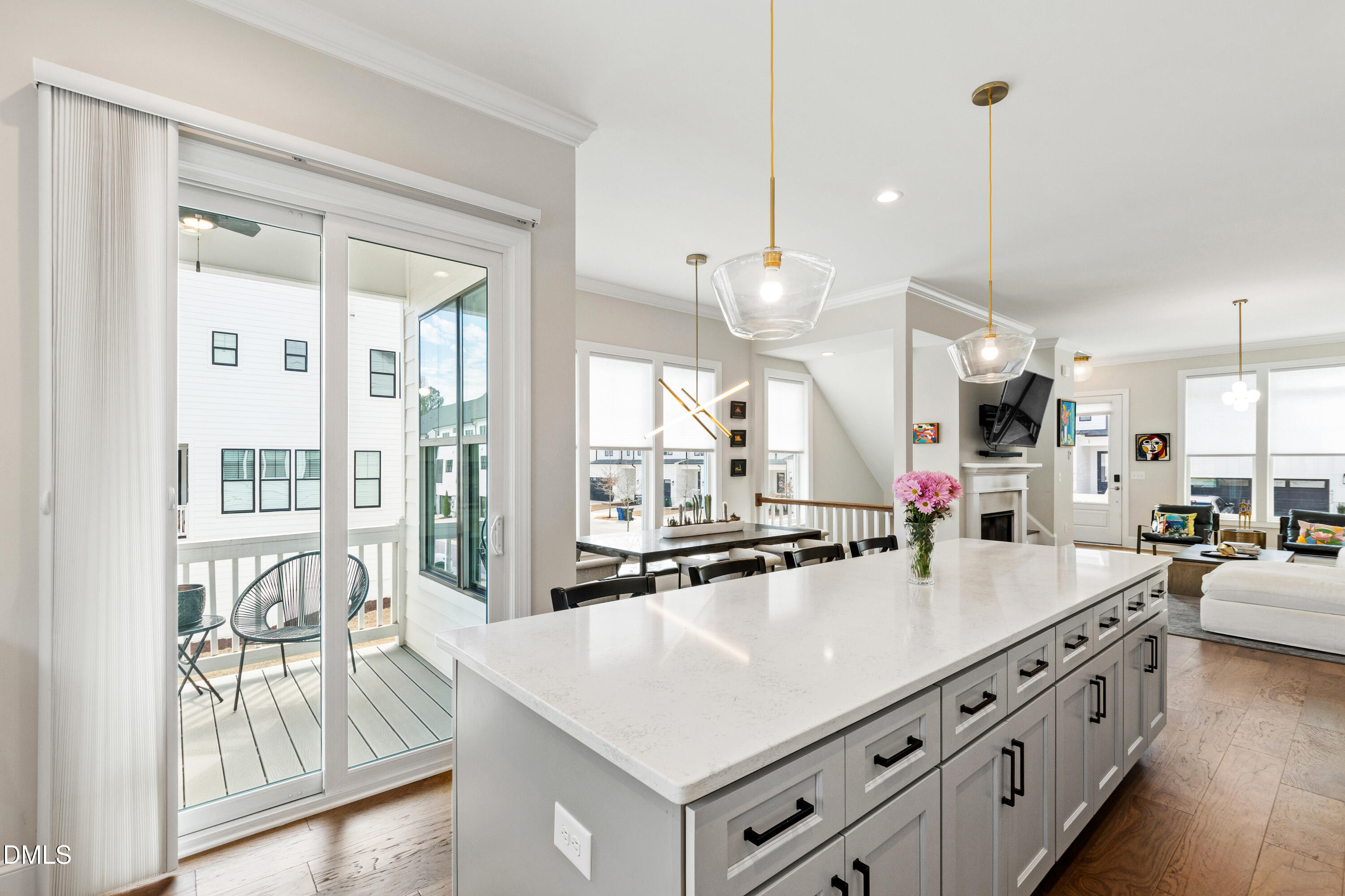 4934 Trek Lane Raleigh, NC 27606 - Photo 9 of 35 a kitchen with stainless steel appliances granite countertop a lot of counter space and living room view