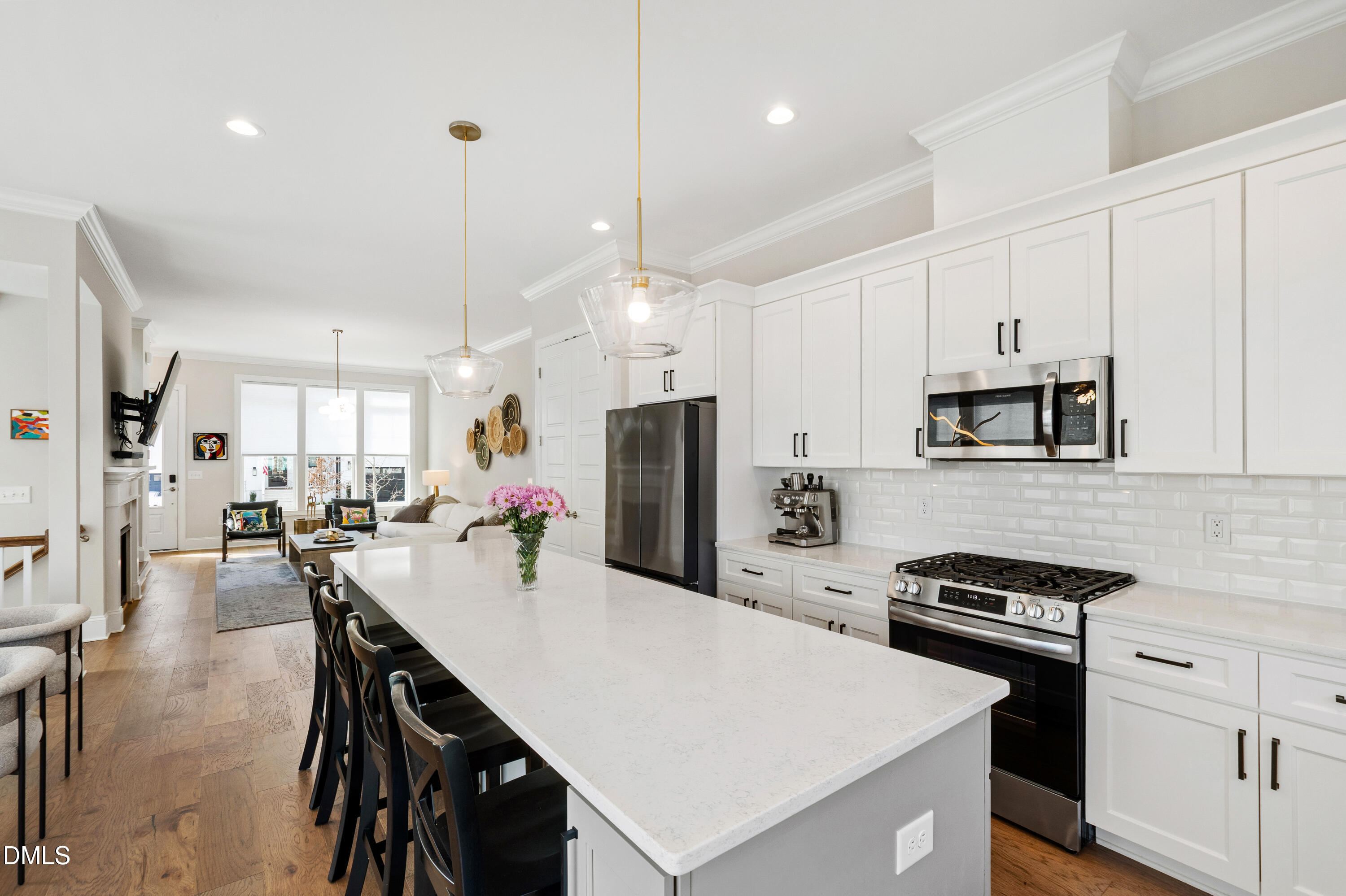 4934 Trek Lane Raleigh, NC 27606 - Photo 10 of 35 a kitchen with stainless steel appliances a stove a sink a stove a refrigerator cabinets and chairs