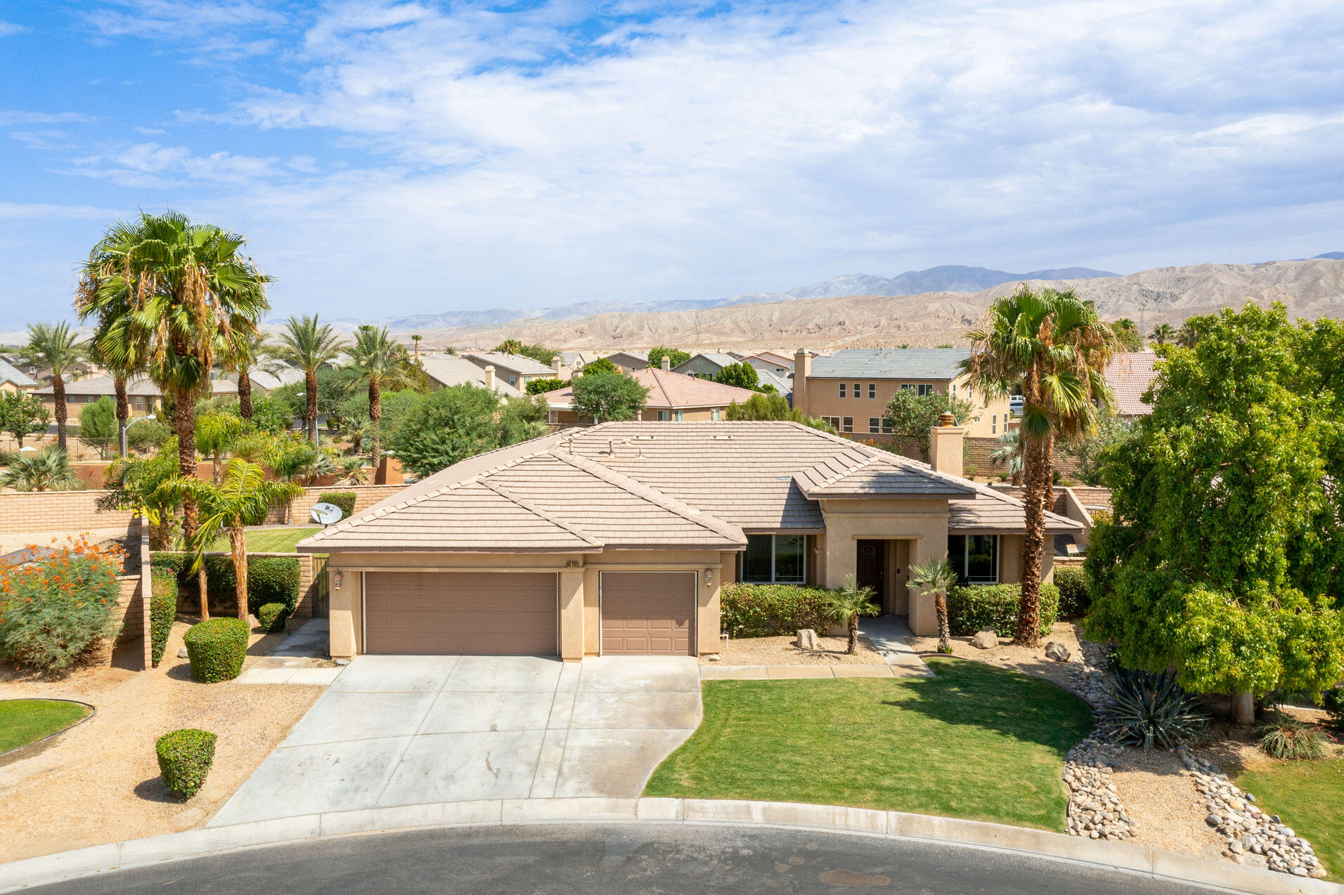 80292 Whitehaven Drive Indio, CA 92203 - Photo 1 of 25 a front view of a house with a garden