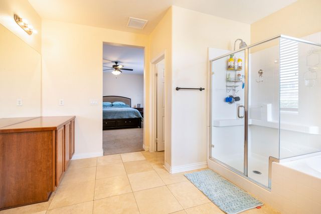 a bathroom with a tub and a shower