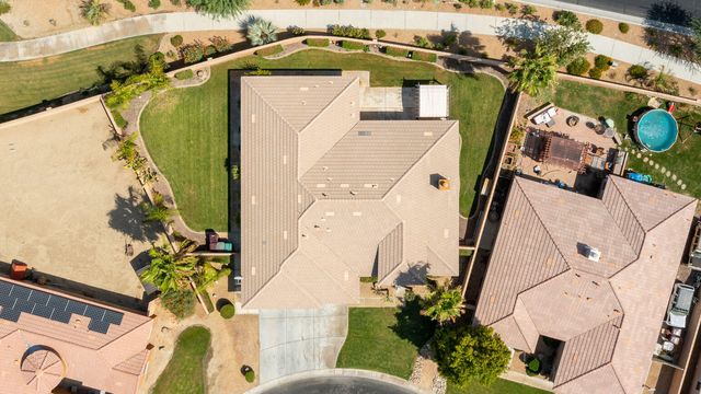 an aerial view of a house with a yard