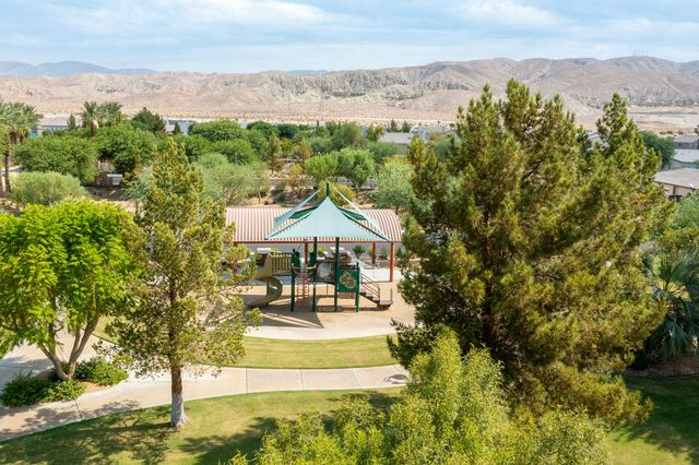 a view of a town with mountains in the background