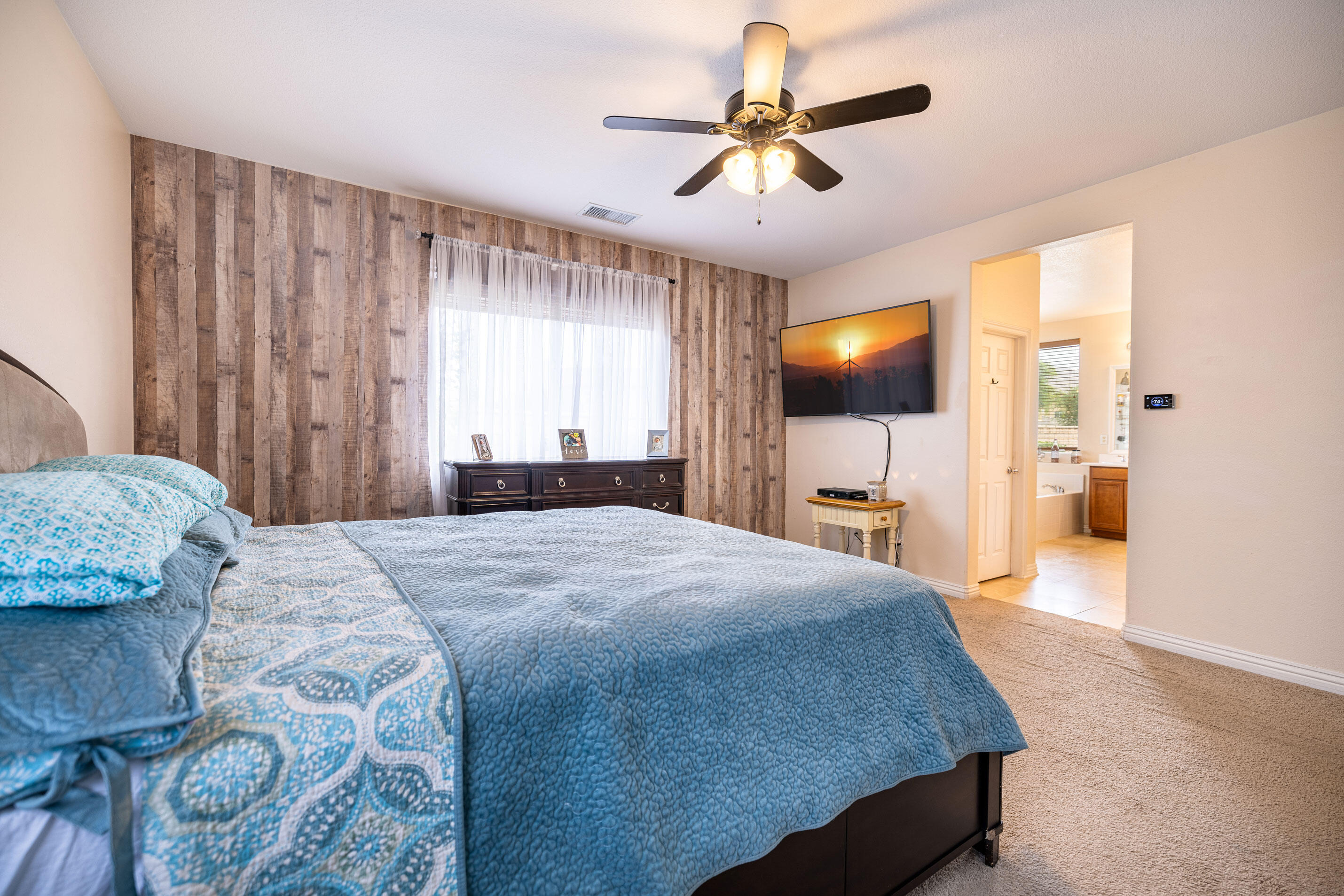 80292 Whitehaven Drive Indio, CA 92203 - Photo 10 of 25 a bed room with a bed and a chandelier