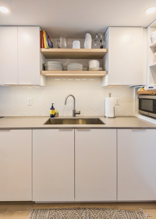 31 Constitution Way, Unit 31 Marblehead, MA 01945 - Photo 11 of 30 a kitchen with a sink