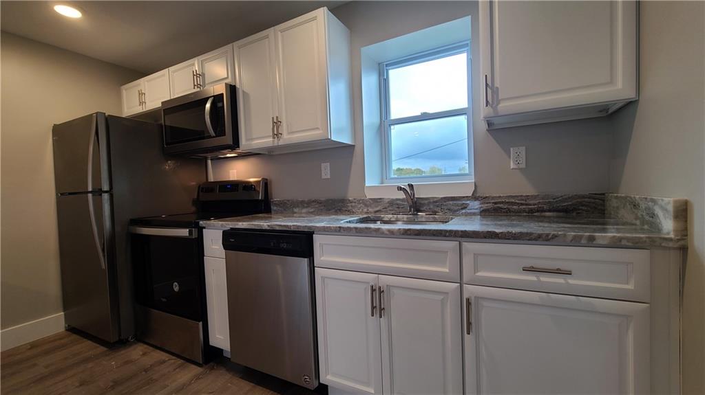 1331 Freeport Road Cheswick, PA 15024 - Photo 3 of 32 a kitchen with stainless steel appliances granite countertop a refrigerator stove and microwave