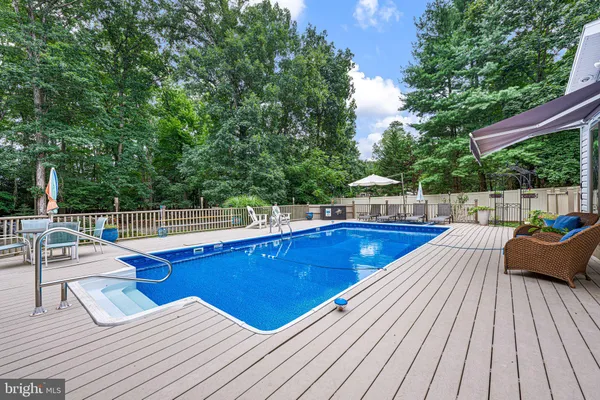 a view of a wooden deck with chairs