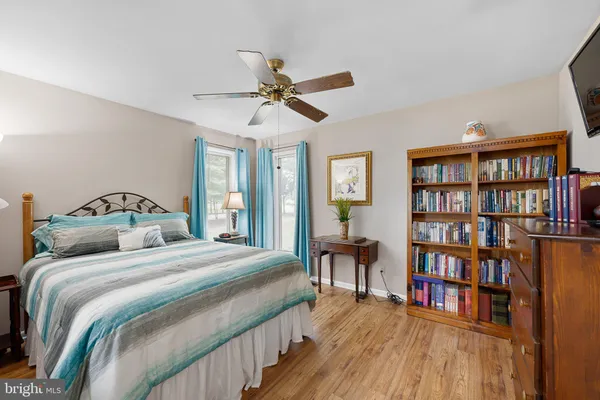 a bedroom with bed and window