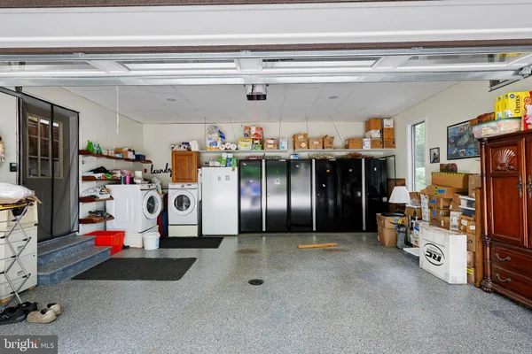 a view of a storage room with racks shoes and chairs