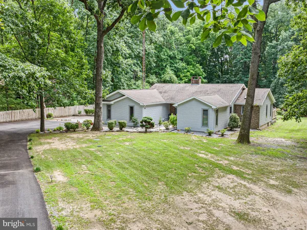 a aerial view of a house with swimming pool and sitting area