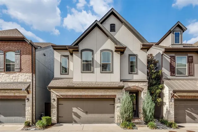 a front view of a house with a garage