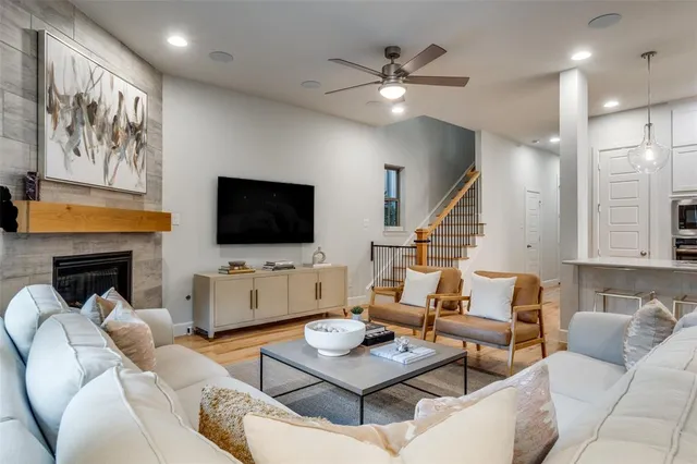 a living room with furniture fireplace and flat screen tv