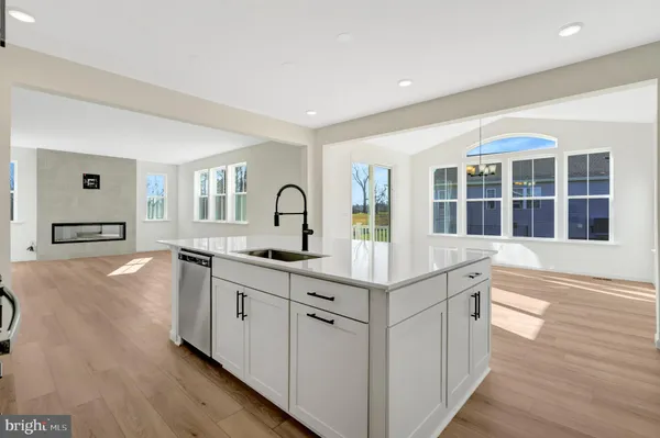 a bathroom with a granite countertop sink mirror and shower