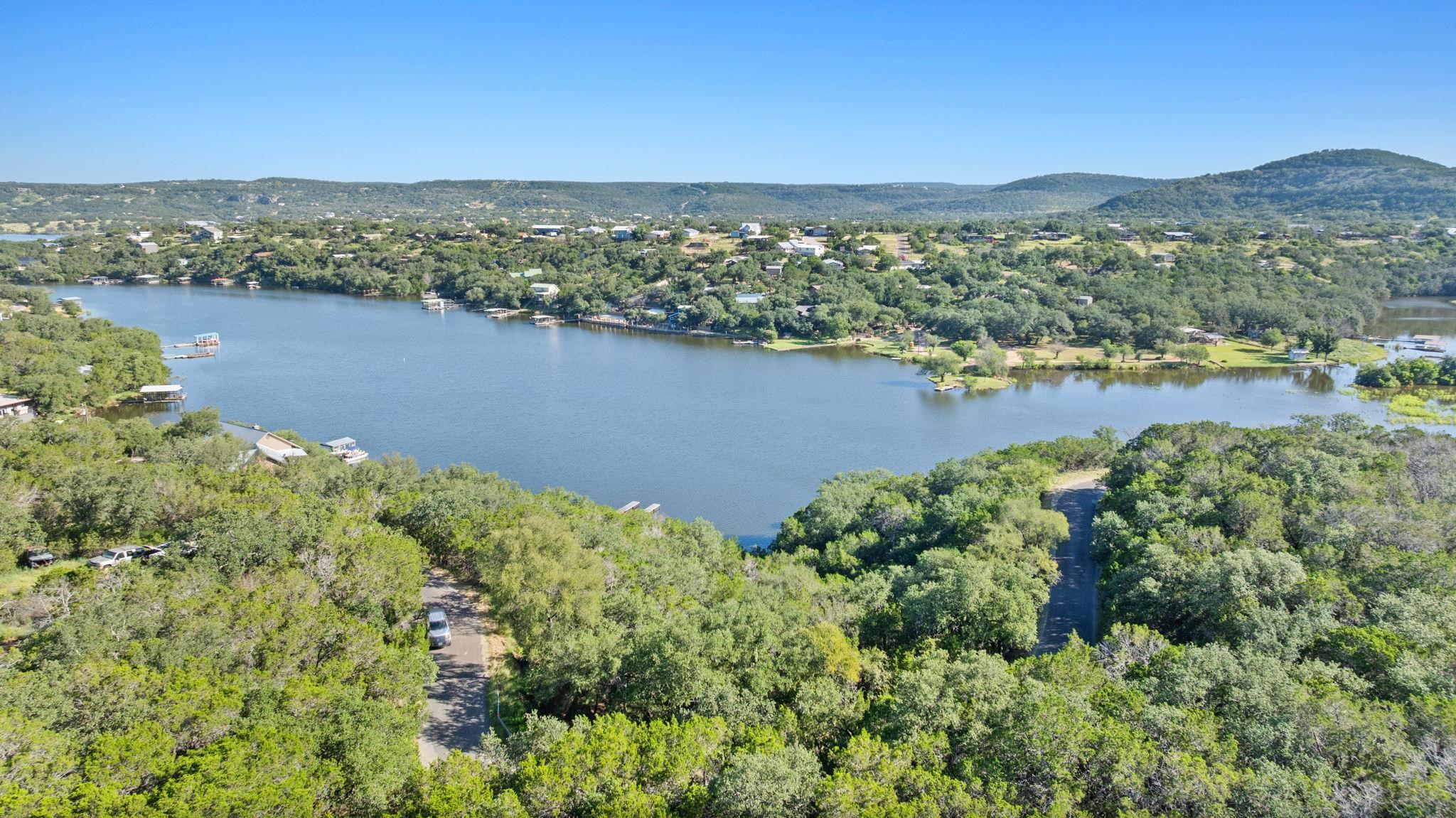 Tbd Sunset Cliff Road Burnet, TX 78611 - Photo 17 of 23 an aerial view of green landscape with trees houses and lake view