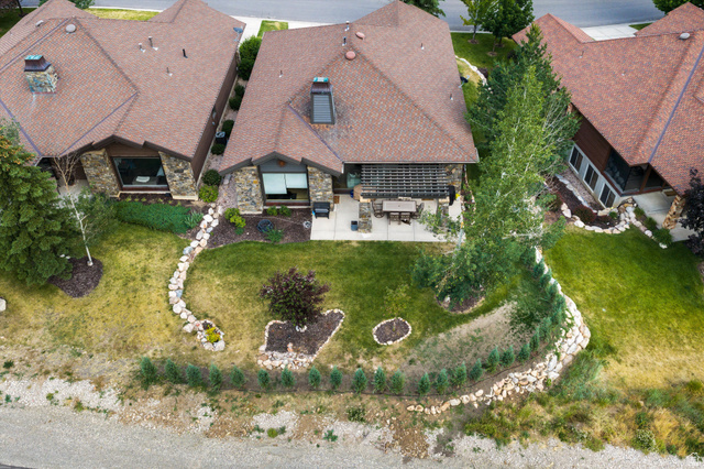 4892 Eagle Rdg Drive Eden, UT 84310 - Photo 30 of 39 Stone-accented exterior with a brown shingle roof and a skylight