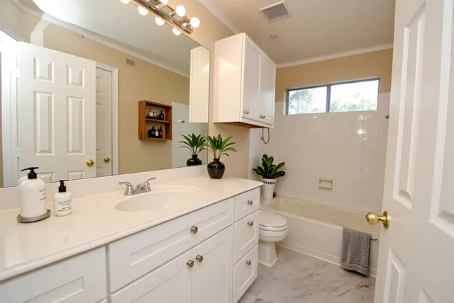 a bedroom with bed and a window