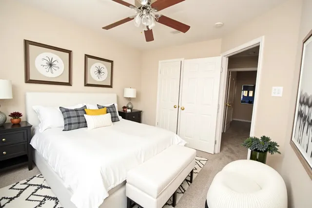 a view of walk in closet with white walls