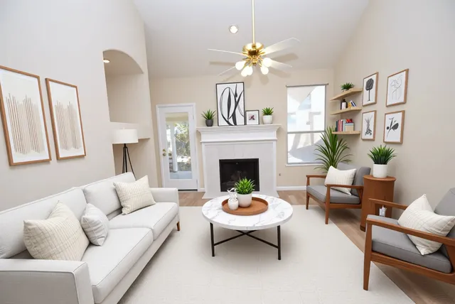 a living room with furniture a lamp and a fireplace