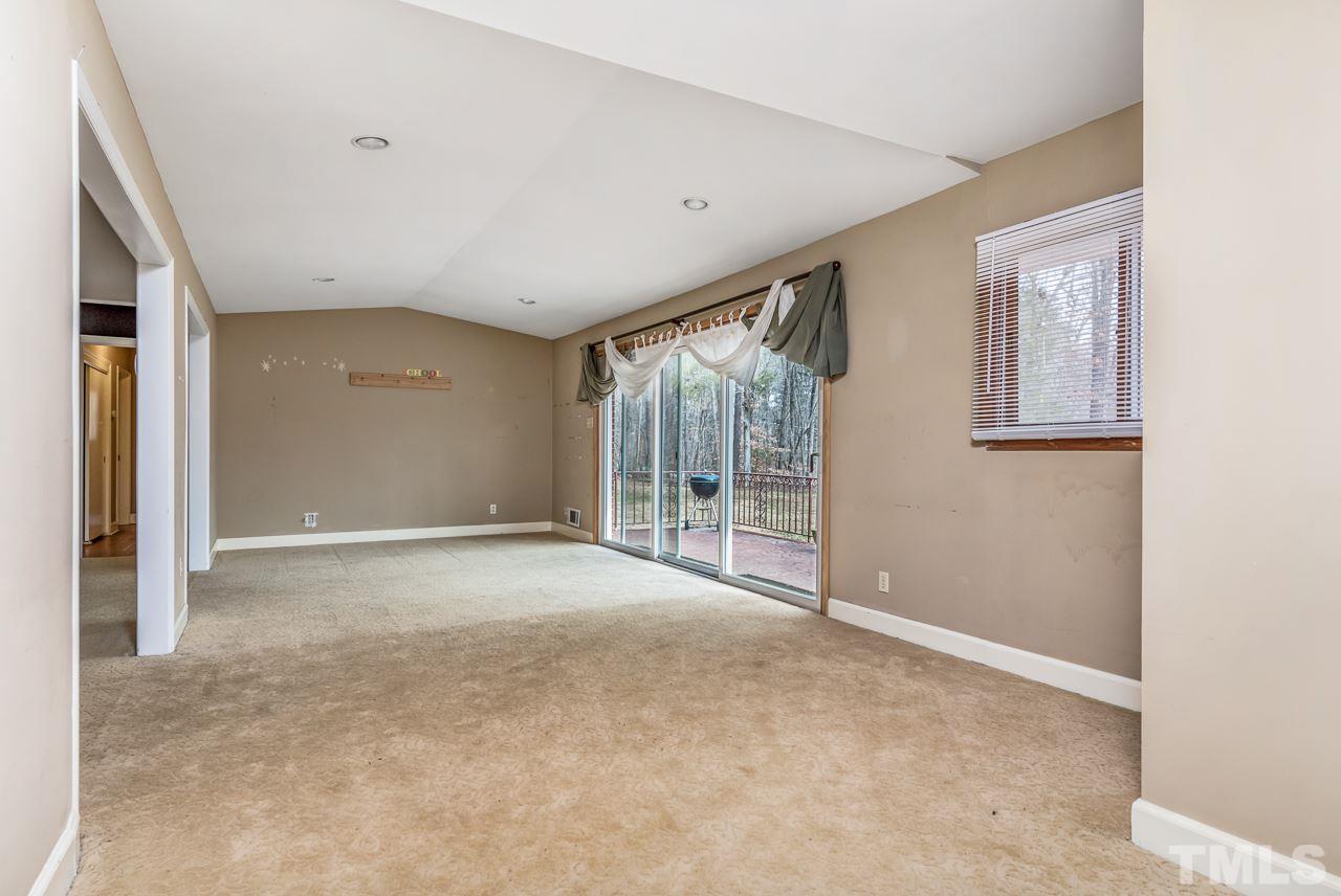 10217 Creedmoor Road Raleigh, NC 27615 - Photo 2 of 24 a view of an empty room with glass door