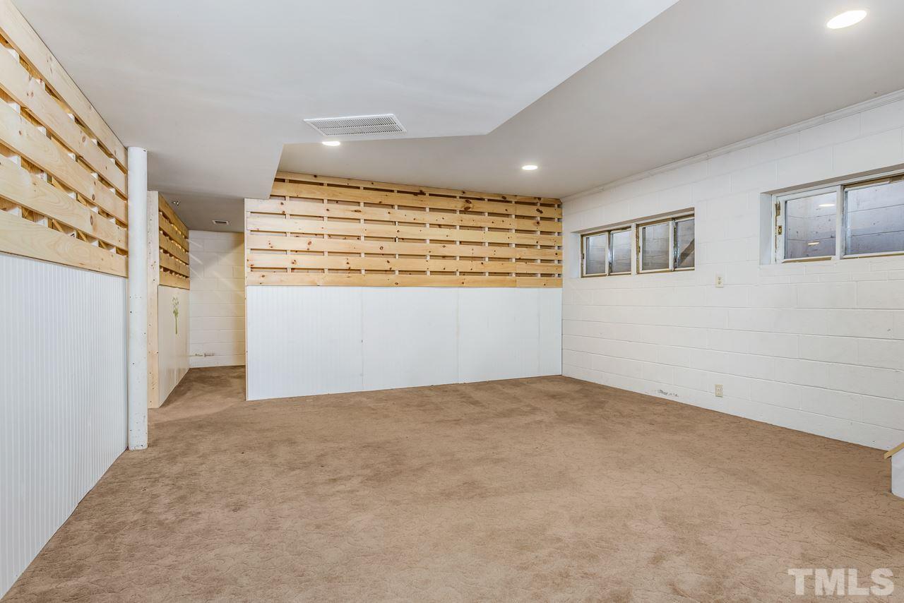 10217 Creedmoor Road Raleigh, NC 27615 - Photo 18 of 24 a view of an empty room with a window