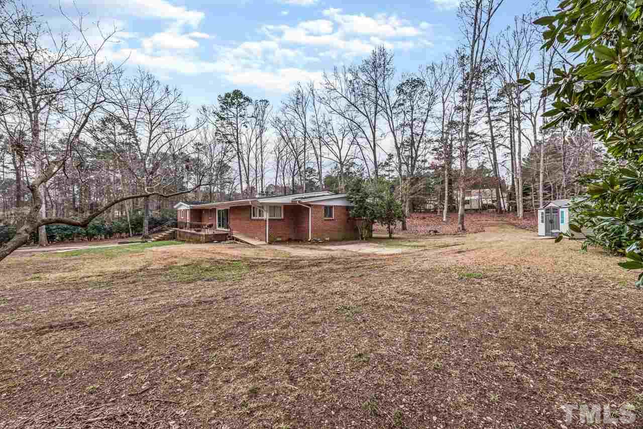 10217 Creedmoor Road Raleigh, NC 27615 - Photo 22 of 24 a view of a outdoor space with trees