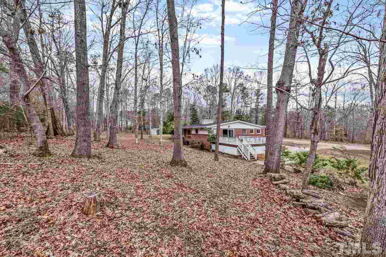 10217 Creedmoor Road Raleigh, NC 27615 - Photo 23 of 24 a backyard of a house with table and chairs