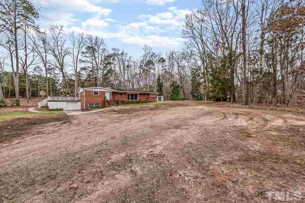 10217 Creedmoor Road Raleigh, NC 27615 - Photo 24 of 24 a view of a field with trees in the background