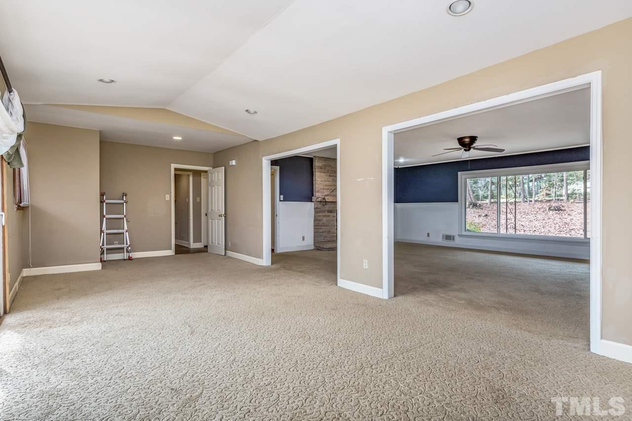 10217 Creedmoor Road Raleigh, NC 27615 - Photo 9 of 24 a view of an empty room with a window