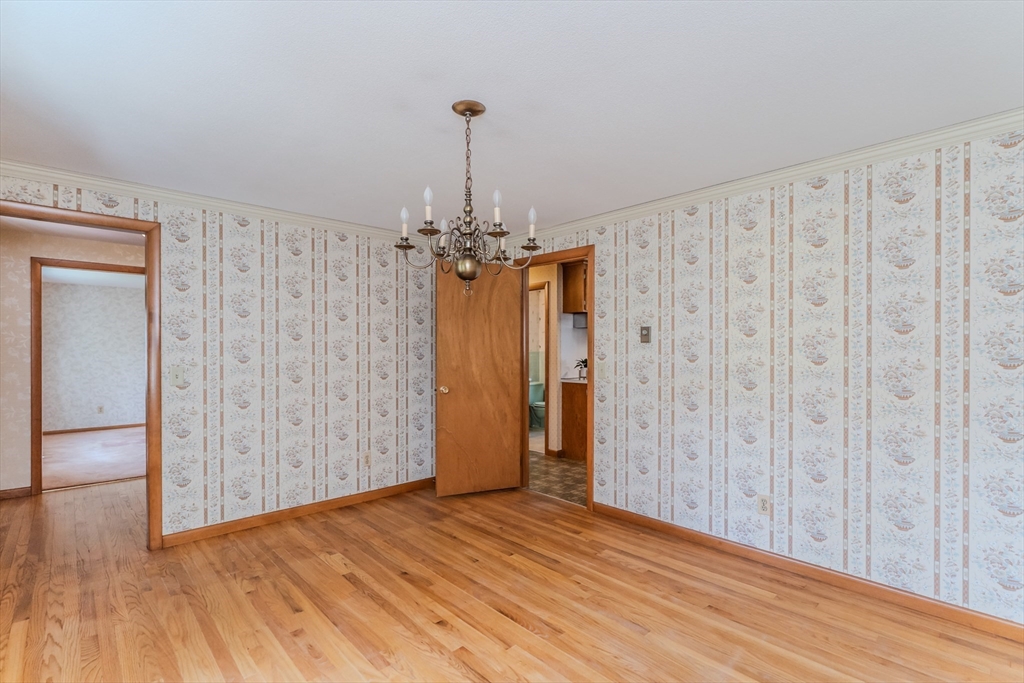 199 Glendale Road Amherst, MA 01002 - Photo 19 of 42 a view of a hallway with wooden floor and stairs