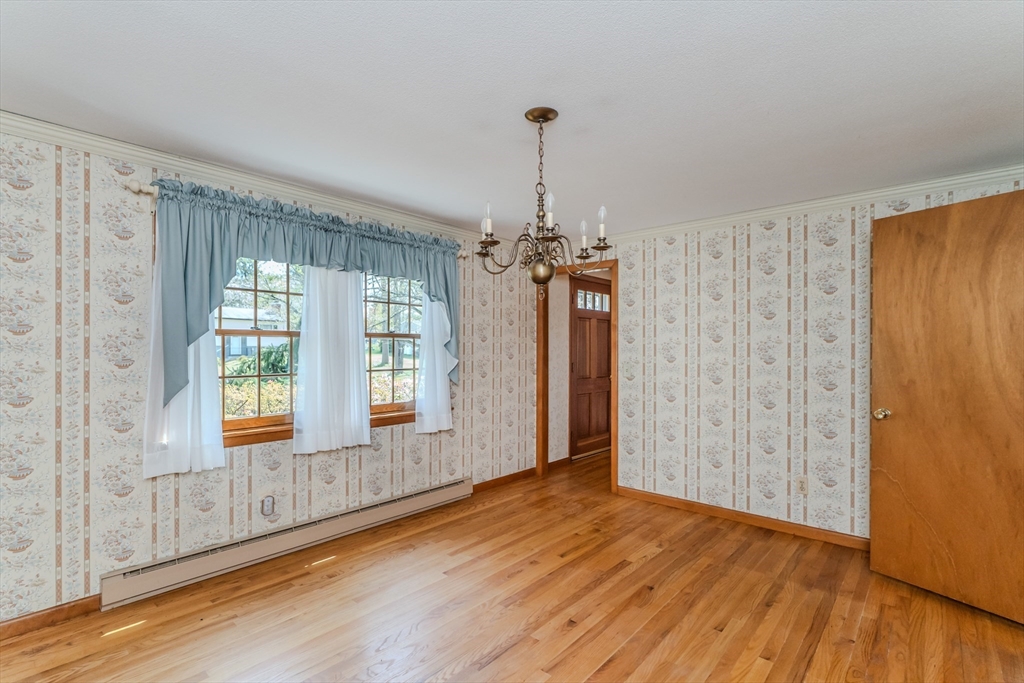 199 Glendale Road Amherst, MA 01002 - Photo 20 of 42 a view of an empty room with wooden floor and a window