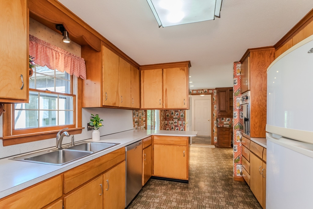 199 Glendale Road Amherst, MA 01002 - Photo 21 of 42 a kitchen with stainless steel appliances granite countertop a sink and a refrigerator