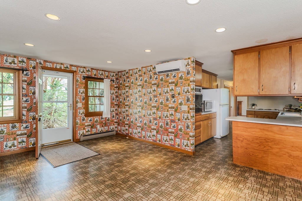199 Glendale Road Amherst, MA 01002 - Photo 25 of 42 a view of an empty room with window and cabinet