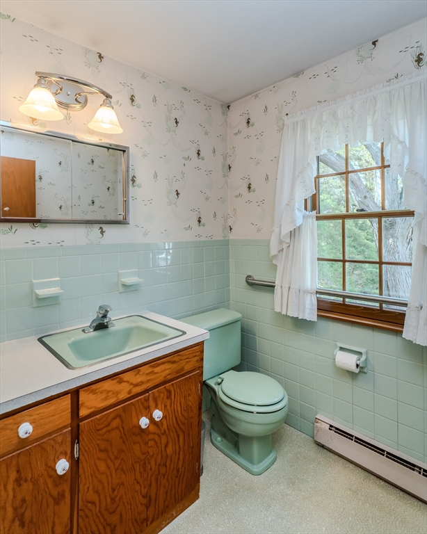 199 Glendale Road Amherst, MA 01002 - Photo 31 of 42 a bathroom with a sink a toilet and mirror