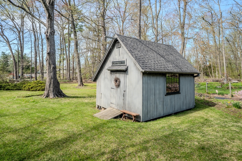 199 Glendale Road Amherst, MA 01002 - Photo 7 of 42 a view of backyard with large tree and wooden fence