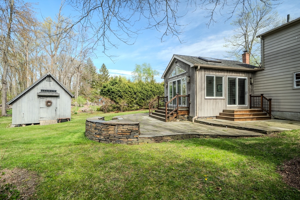 199 Glendale Road Amherst, MA 01002 - Photo 10 of 42 a view of a house with a yard and sitting area