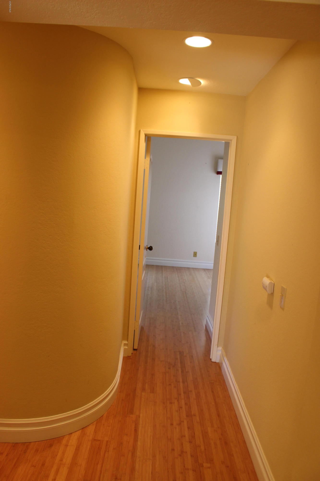 605 Galloping Hill Road Simi Valley, CA 93065 - Photo 12 of 35 a view of a room with wooden floor and a hallway