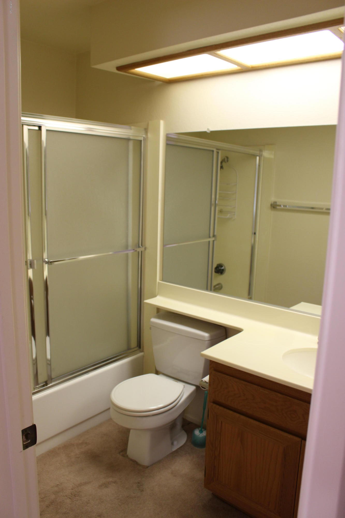 605 Galloping Hill Road Simi Valley, CA 93065 - Photo 23 of 35 a bathroom with a toilet a sink and shower