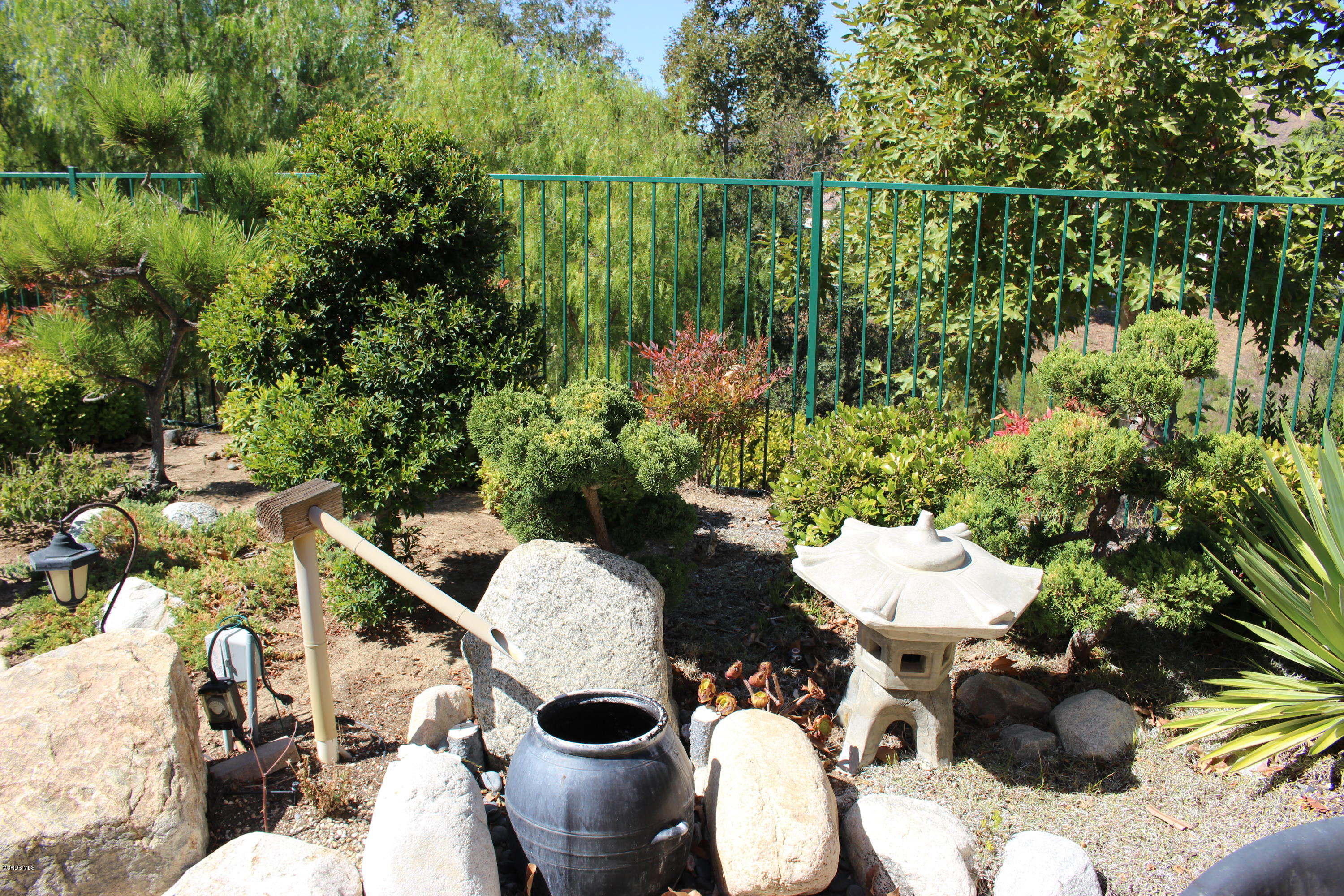 605 Galloping Hill Road Simi Valley, CA 93065 - Photo 28 of 35 a view of a chairs and table in a patio