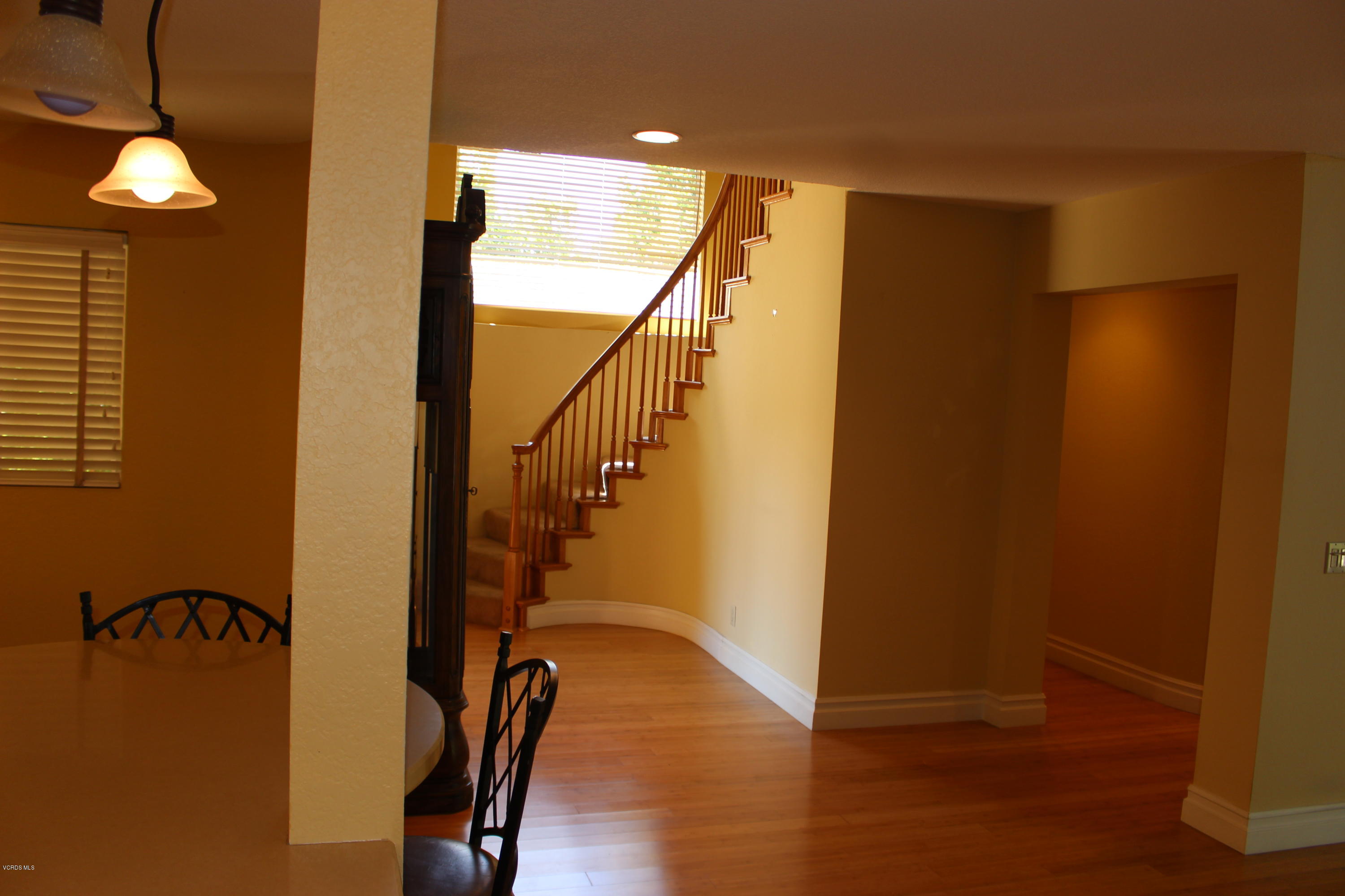 605 Galloping Hill Road Simi Valley, CA 93065 - Photo 5 of 35 a view of empty room with stairs and wooden floor