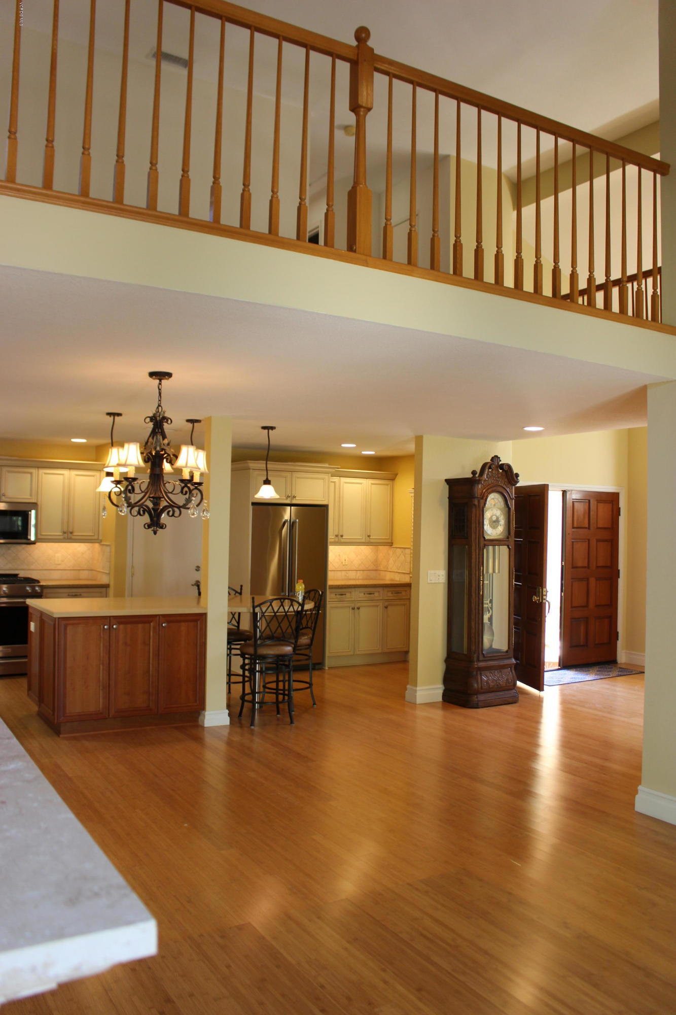 605 Galloping Hill Road Simi Valley, CA 93065 - Photo 9 of 35 a hallway with a dining table and chairs