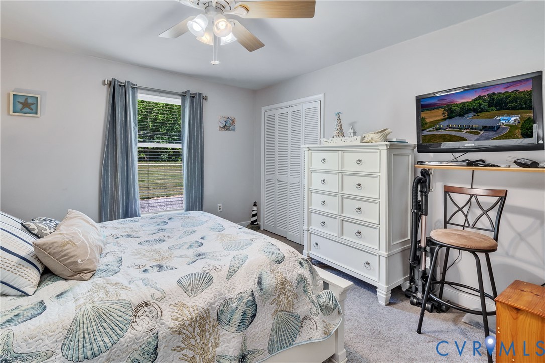 4400 Hacks Neck Road Heathsville, VA 22473 - Photo 22 of 78 a bedroom with a bed and a flat screen tv