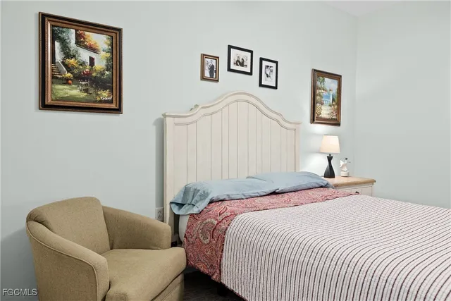 a bedroom with a bed and a couch