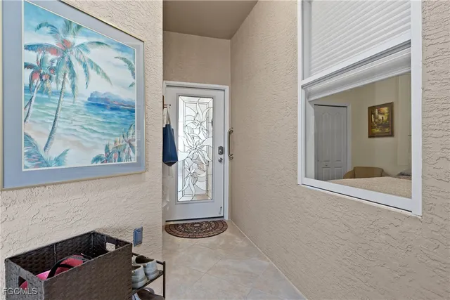 a bathroom with a window and a mirror