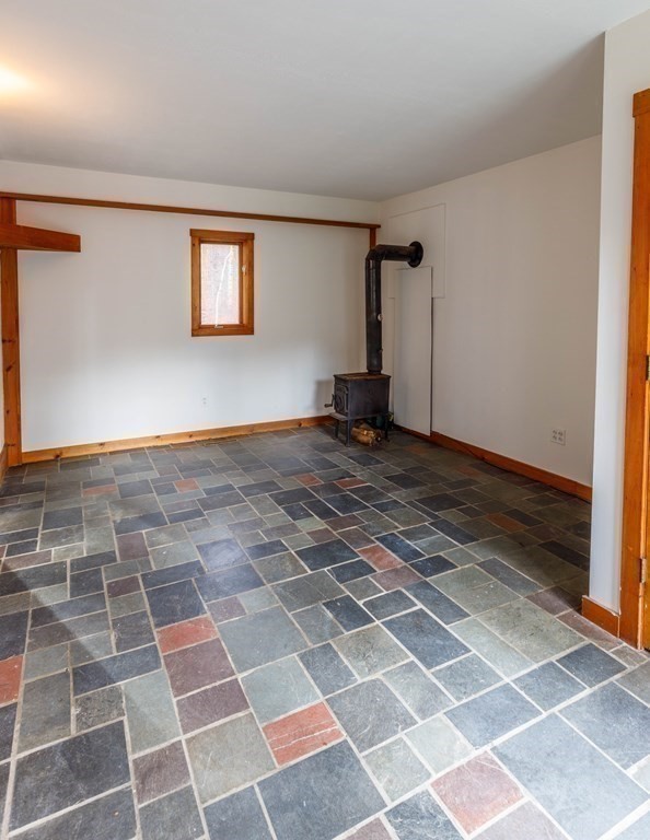 202 North Valley Road Pelham, MA 01002 - Photo 6 of 33 a view of a livingroom with a black and white checkered floor