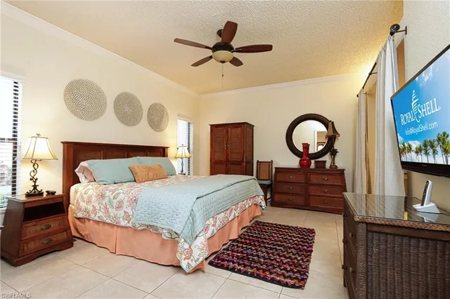 a bedroom with a bed and dresser