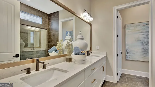 a bathroom with double vanity sink and a mirror