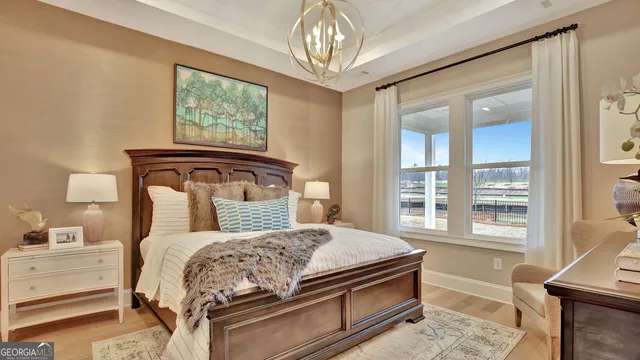 a bedroom with a large bed and a window