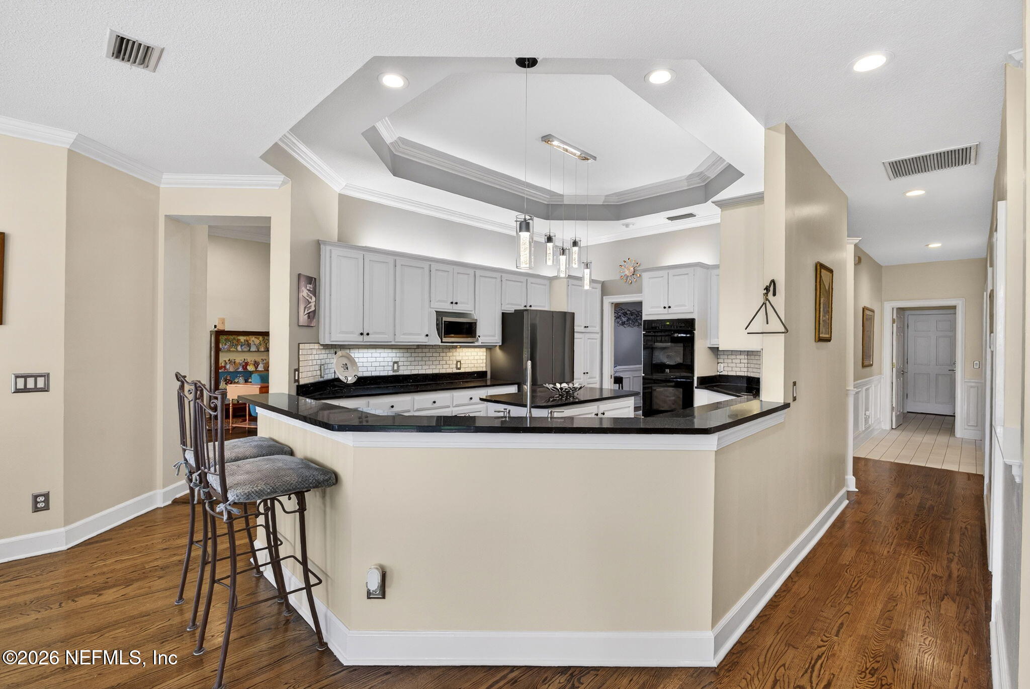 7914 Mc Laurin Road North Jacksonville, FL 32256 - Photo 11 of 44 a large kitchen with stainless steel appliances granite countertop a stove and a refrigerator