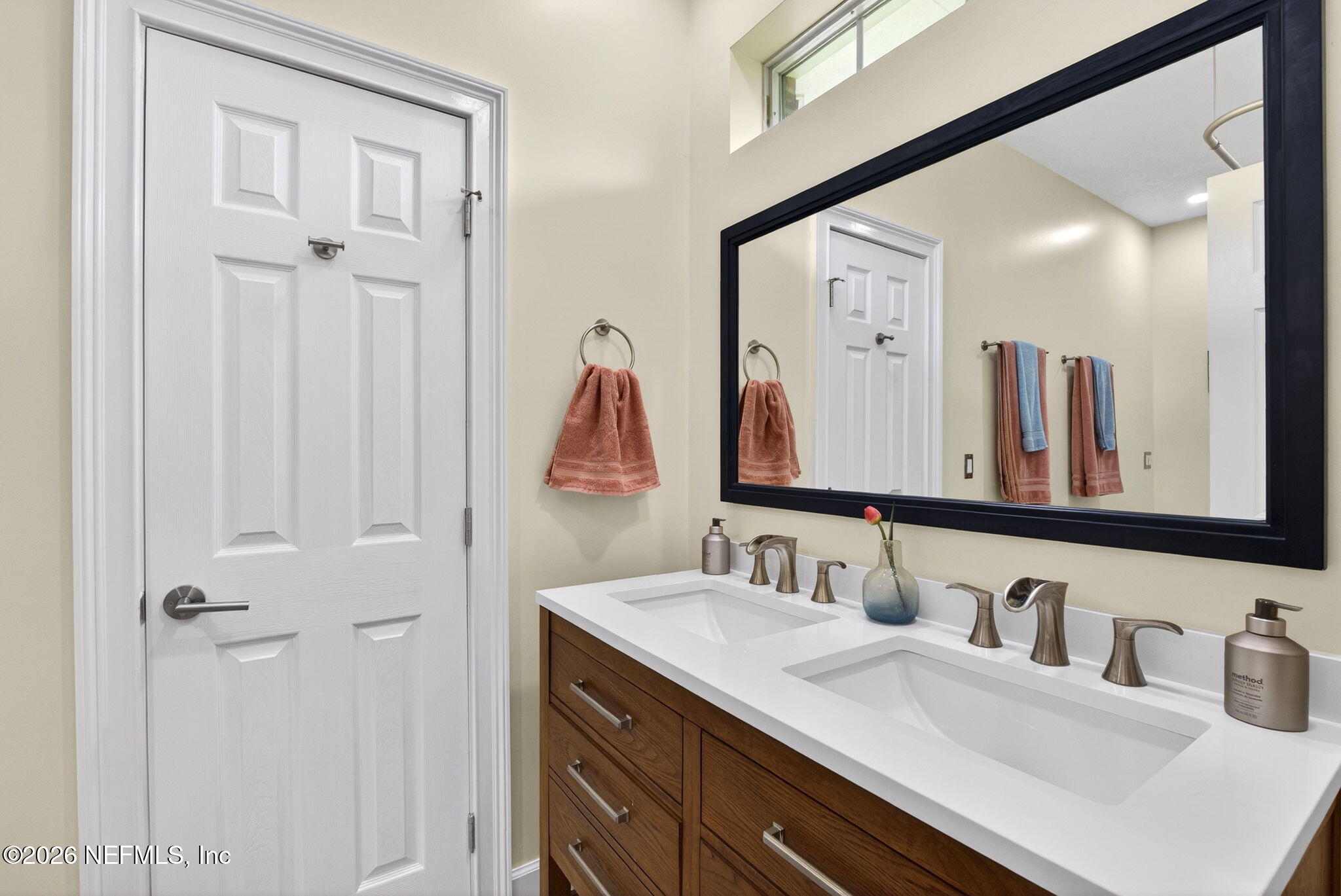 7914 Mc Laurin Road North Jacksonville, FL 32256 - Photo 23 of 44 a bathroom with a sink and a mirror